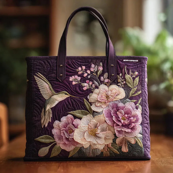 Gequilte paarse boodschappentas met kolibries en orchideeën